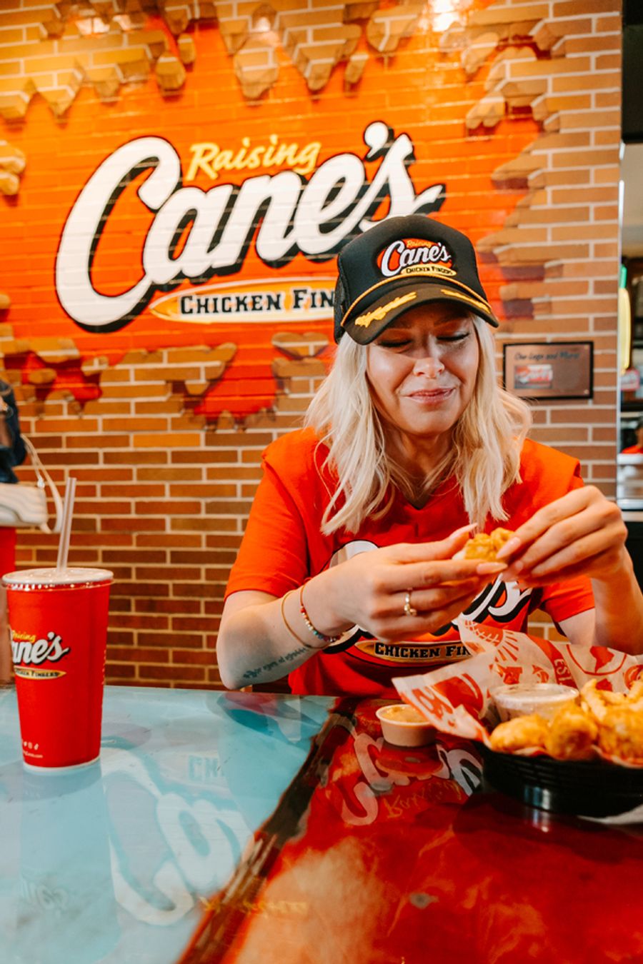 Photos: Ariana Madix Puts Sauce in the #Scandoval, Serves Caniacs at Raising Cane's in El Segundo, CA Image