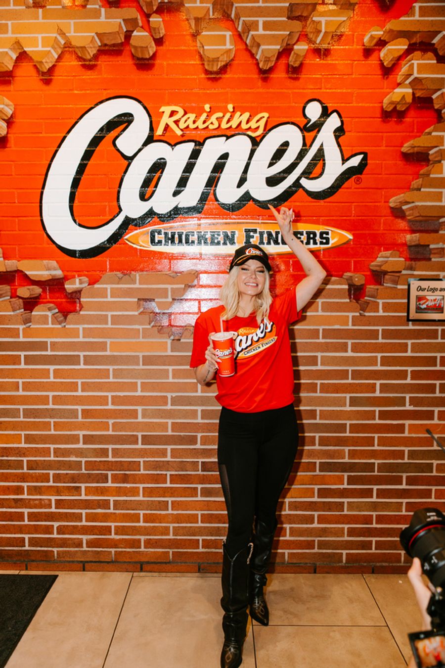 Photos: Ariana Madix Puts Sauce in the #Scandoval, Serves Caniacs at Raising Cane's in El Segundo, CA Image