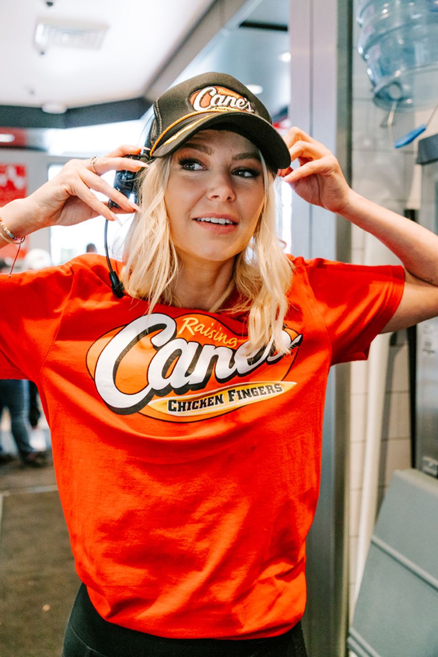 Photos: Ariana Madix Puts Sauce in the #Scandoval, Serves Caniacs at Raising Cane's in El Segundo, CA Image