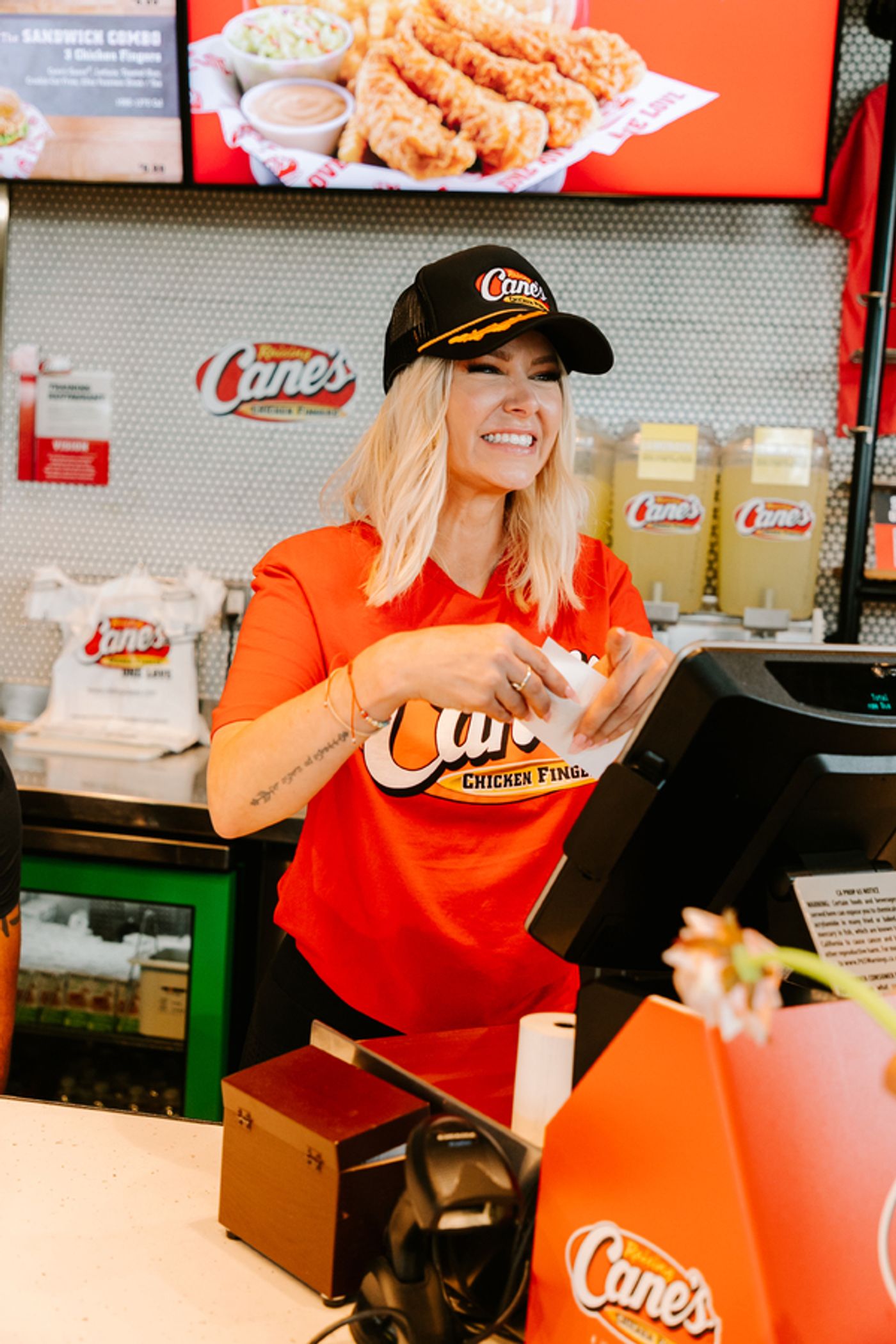 Photos: Ariana Madix Puts Sauce in the #Scandoval, Serves Caniacs at Raising Cane's in El Segundo, CA  Image