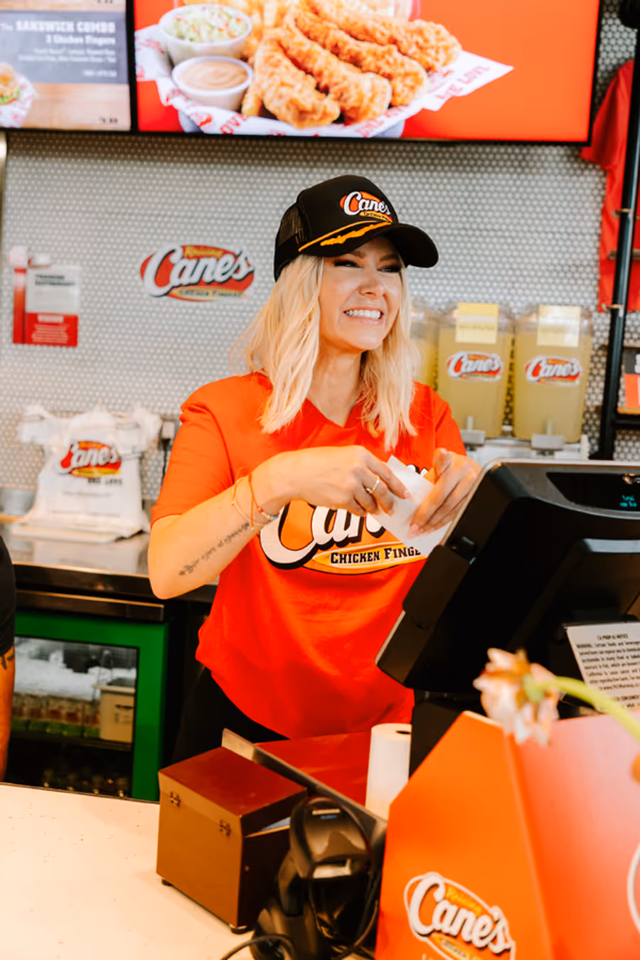 Photos: Ariana Madix Puts Sauce in the #Scandoval, Serves Caniacs at Raising Cane's in El Segundo, CA Image