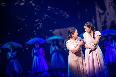 Melody Butiu (Estrella Cumpas), Arielle Jacobs (Imelda Marcos), and the cast of Here  Photo