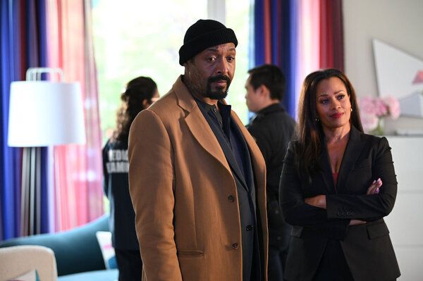 Jesse L. Martin as Alec Mercer, Maahra Hill as Marisa Photo