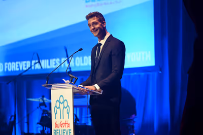 NEW YORK, NEW YORK - SEPTEMBER 18: Cody Saintgnue speaks onstage during the 9th Annua Photo