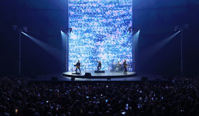 Bono, The Edge, Adam Clayton and Bram van den Berg Photo