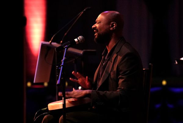 NEW YORK, NEW YORK - NOVEMBER 06: <<enter caption here>> speaks onstage while Eugene  Photo