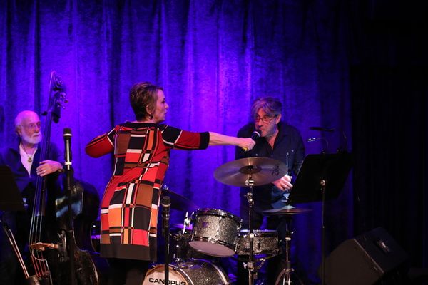 The raffle drawing, featuring Clint de Ganon on drums and John Miller on bass. Photo