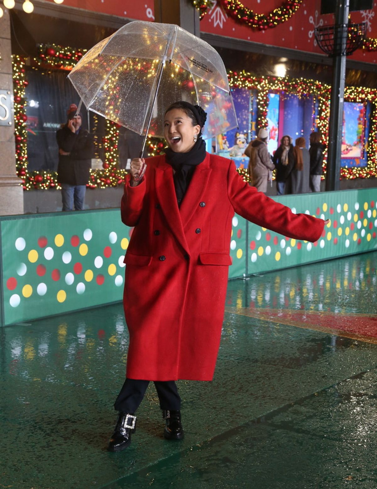Ashley Park rehearsing for the Macy's Thanksgiving Day Parade on 34th Street in the rain at 