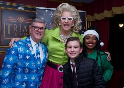 Doris Dear, Jim McGinnis and Cooper daSilva with Alzheimers Association''s Tamika Phi Photo