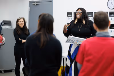 Diane Paulus and Qween Jean addressing the company Photo