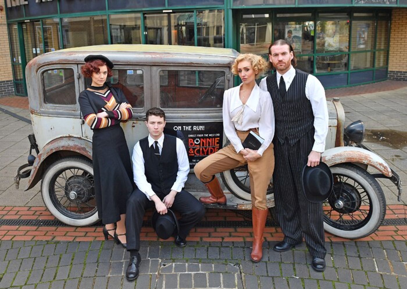Photos: BONNIE & CLYDE Cast Pose With a Vintage 1929 Ford Model A Saloon  Image