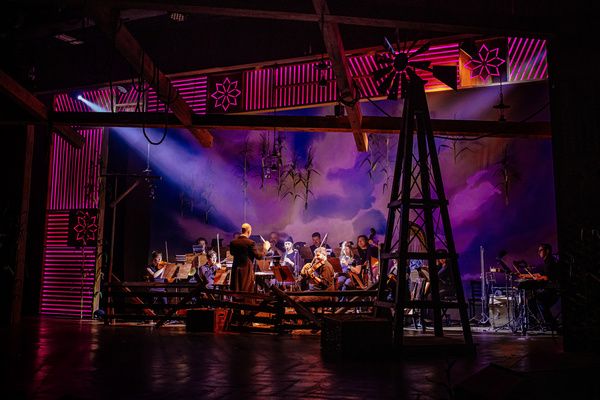 R. Mackenzie Lewis (Conductor/Music Director) and orchestra Photo