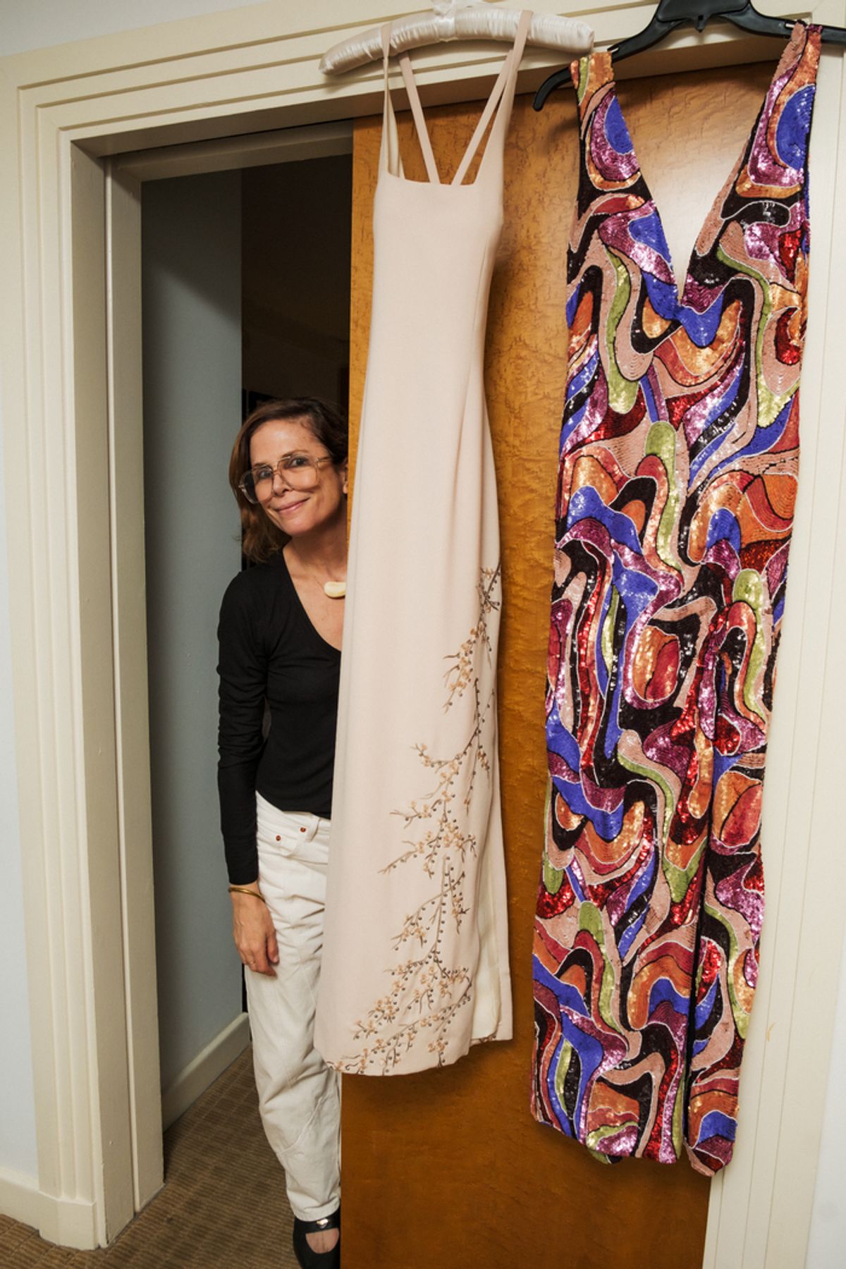 Stylist Christina Ehrlich with the two Nicole Miller dresses I'll wear that night. at 