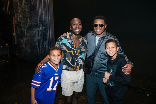Jackie Jackson with his two sons and John Edwards Photo