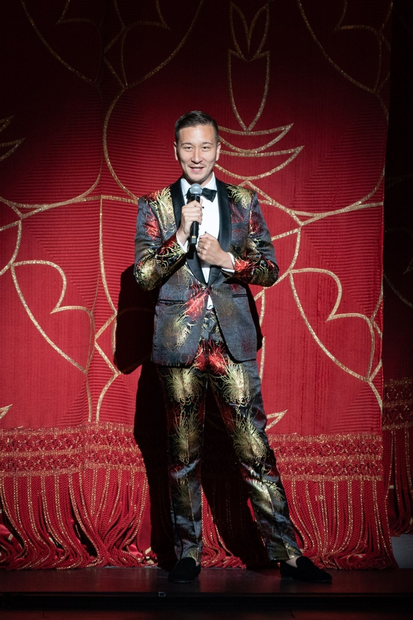 10,000 Dreams co-curator Phil Chan during curtain speech on June 22, 2024. Photo by Teresa Wood.