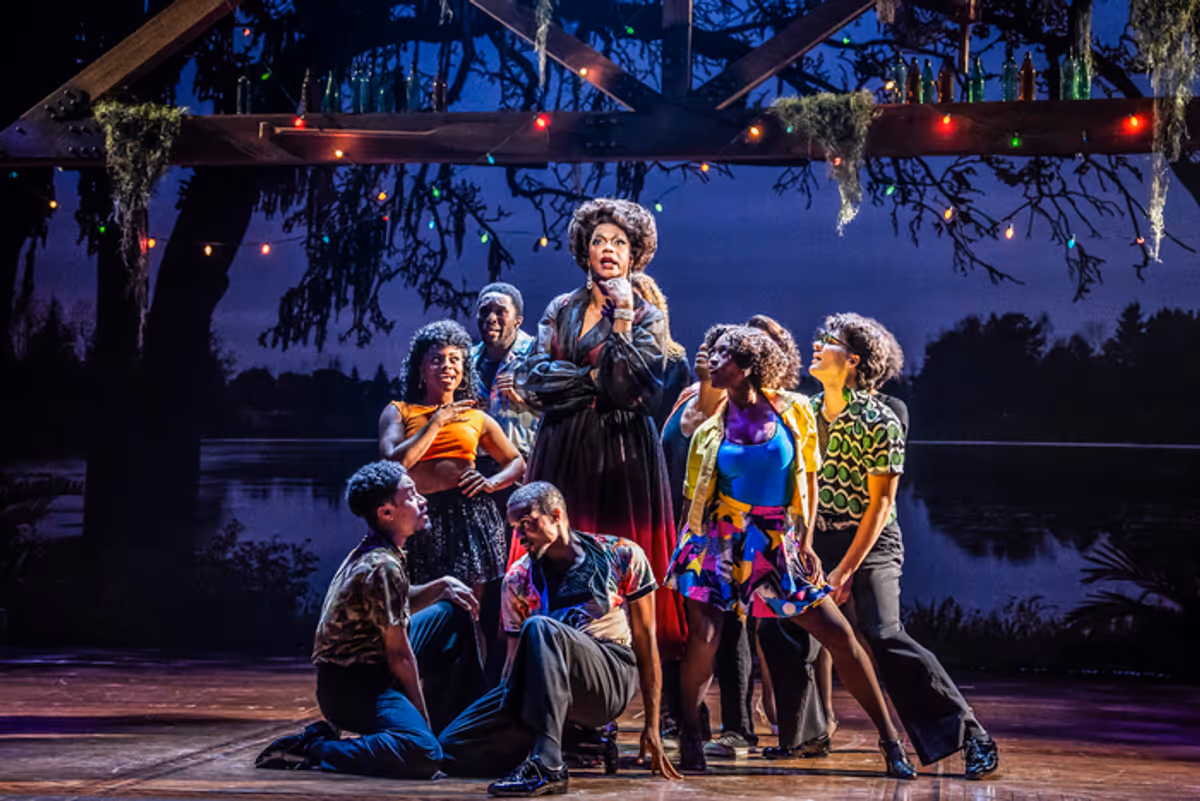 J. Harrison Ghee (center) and ensemble members  at 