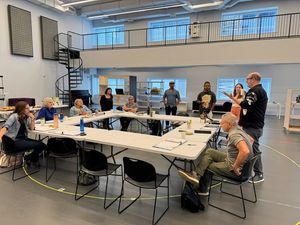 Director Christopher Ashley address the cast and creative team of Babbitt. Photo