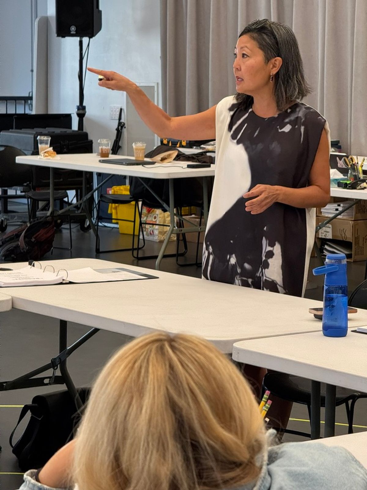 Costume designer Linda Cho shares the designers for Babbitt with the cast and creative team. at 