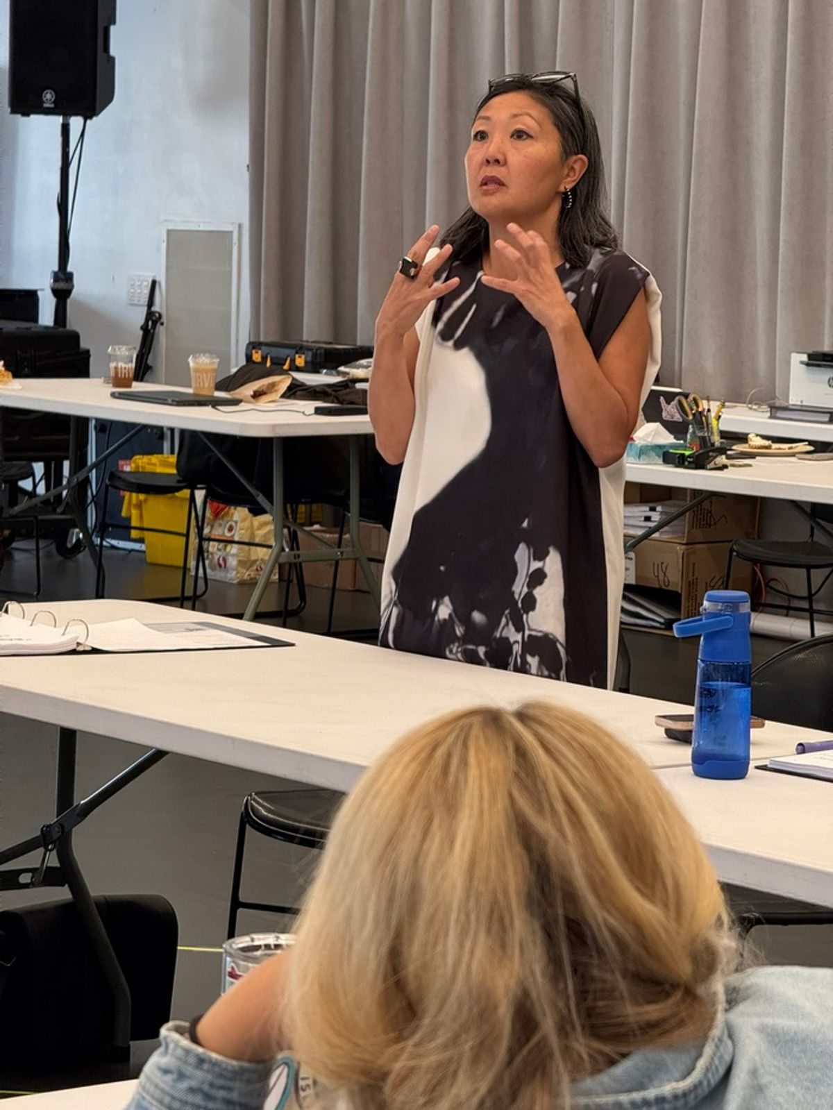 Costume designer Linda Cho shares the designers for Babbitt with the cast and creative team. at 