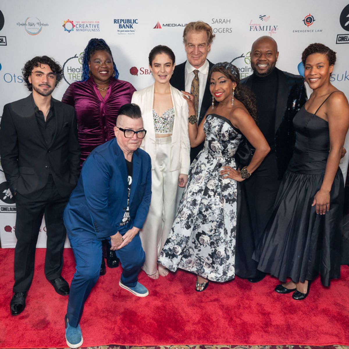 Back to front, left to right: Adam Irigoyen, Tiffany Mann, Kevin Kilner, Matthew Sims, Jr., Paige Smallwood, Lea DeLaria, Marissa Ghavami, N?Kenge at 