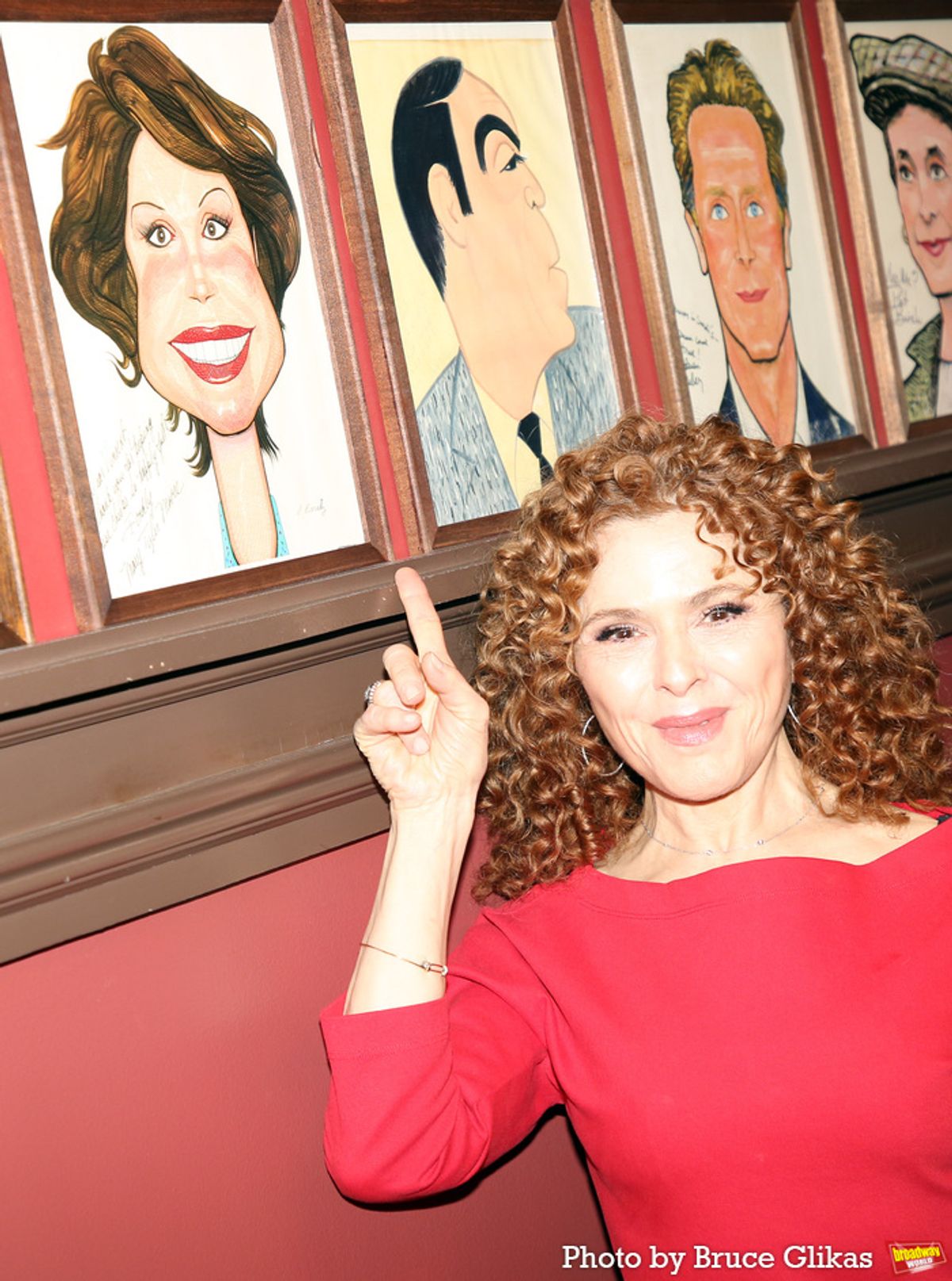 Bernadette Peters posing with Mary Tyler Moore's portrait at 