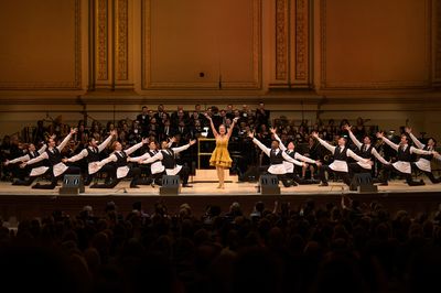 Jennifer Simard sings “Hello, Dolly!” with the men of the Hello, Dolly! Dance Ens Photo