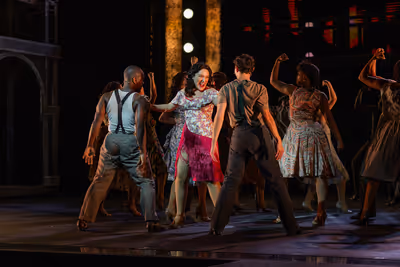 Katerina McCrimmon and members of the company of the 2025 Muny production of "Evita." Photo