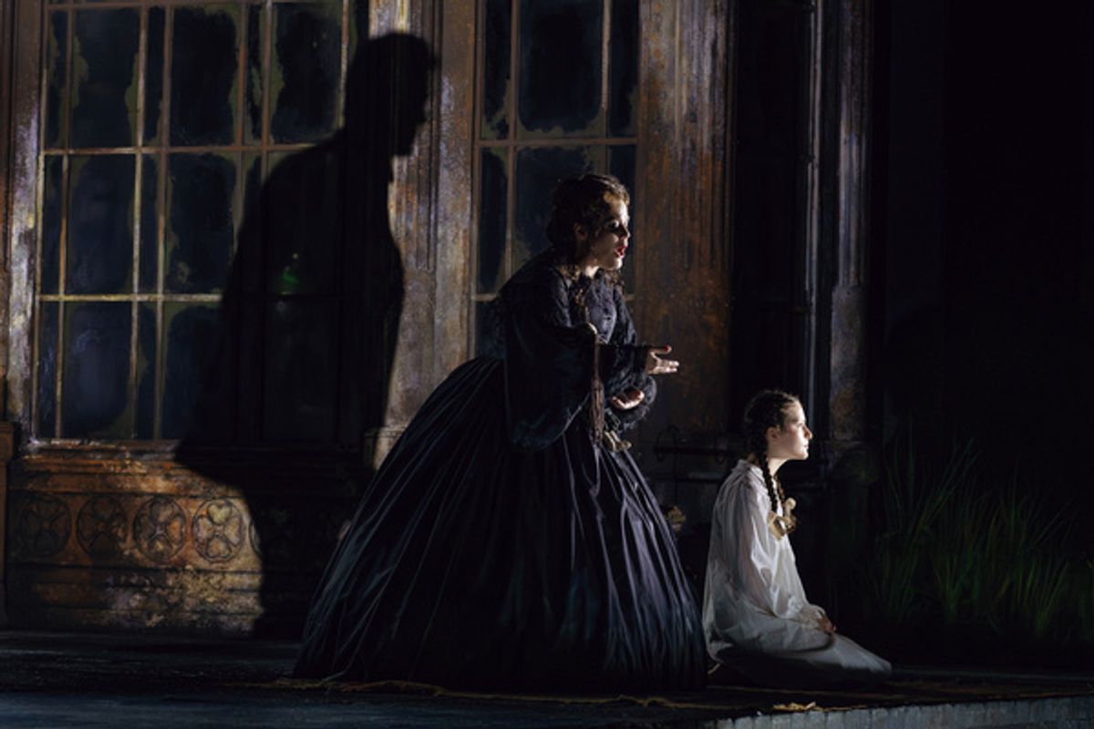Brenton Ryan (Peter Quint in shadow), Wendy Bryn Harmer (Miss Jessel), Annie Blitz (Flora), photo by Curtis Brown for the Santa Fe opera at 