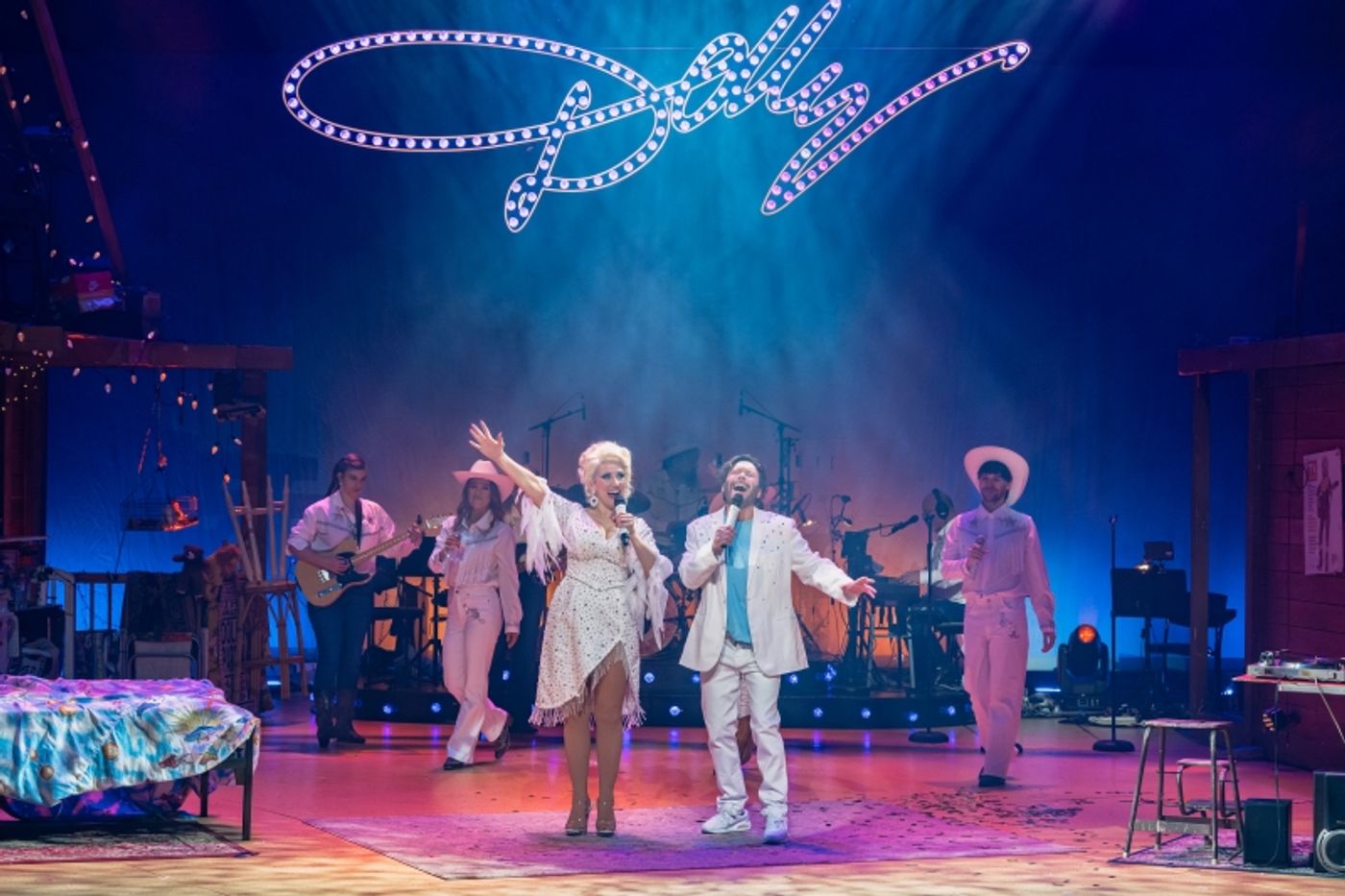 Review: HERE YOU COME AGAIN Is A Wholesome And Heartwarming Celebration of The Queen of Country, Dolly Parton  Image