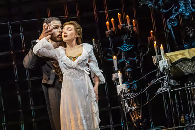 Isaiah Bailey as The Phantom and Jordan Lee Gilbert as Christine Daae Photo