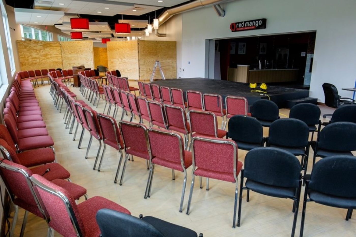 A group of chairs surround a makeshift stage in Parliament Hall while FAU’s Theater Lab was being constructed. Photo by Mohammed F. Emran, University Press
