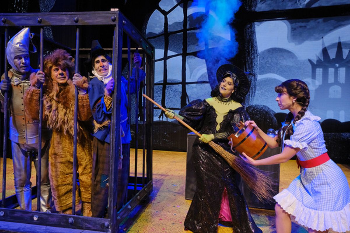 From the left are Douglas Ladnier as Tin Man, and Mark Gagliardi as Lion, John Schartzer as  Scarecrow, Aubrey Anderson-Emmons as Dorothy, and Nicole Parker as Wicked Witch. Photo by Josh Kaplan.  at 