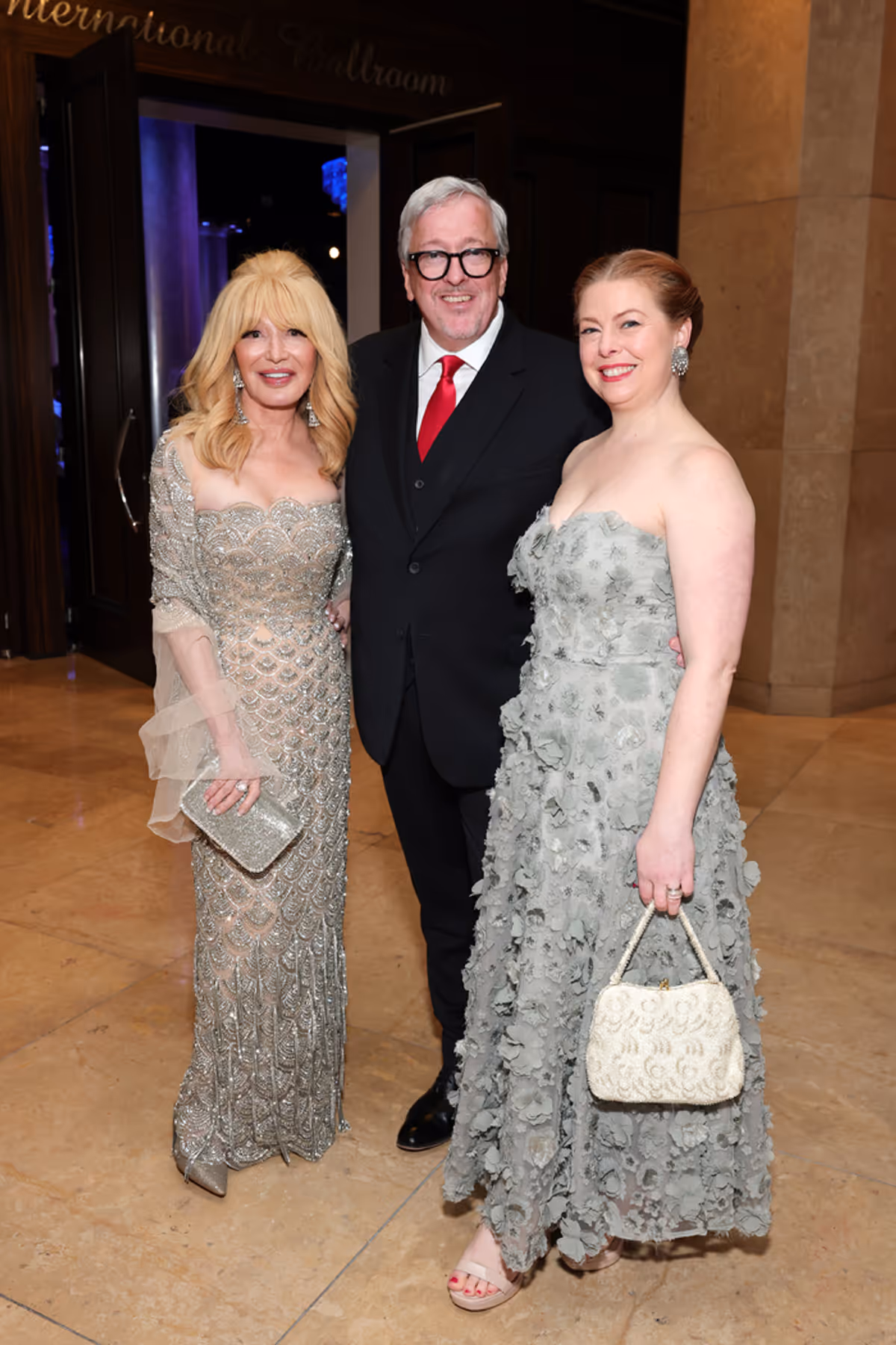 BEVERLY HILLS, CALIFORNIA - DECEMBER 15: (L-R) Elizabeth Segerstrom, Barry Hughson, Executive Director, ABT and Ashley Hughson attend American Ballet Theatre's (ABT) Holiday Benefit at The Beverly Hilton on December 15, 2025 in Beverly Hills, California. (Photo by Emma McIntyre/Getty Images for American Ballet Theatre (ABT)) at 