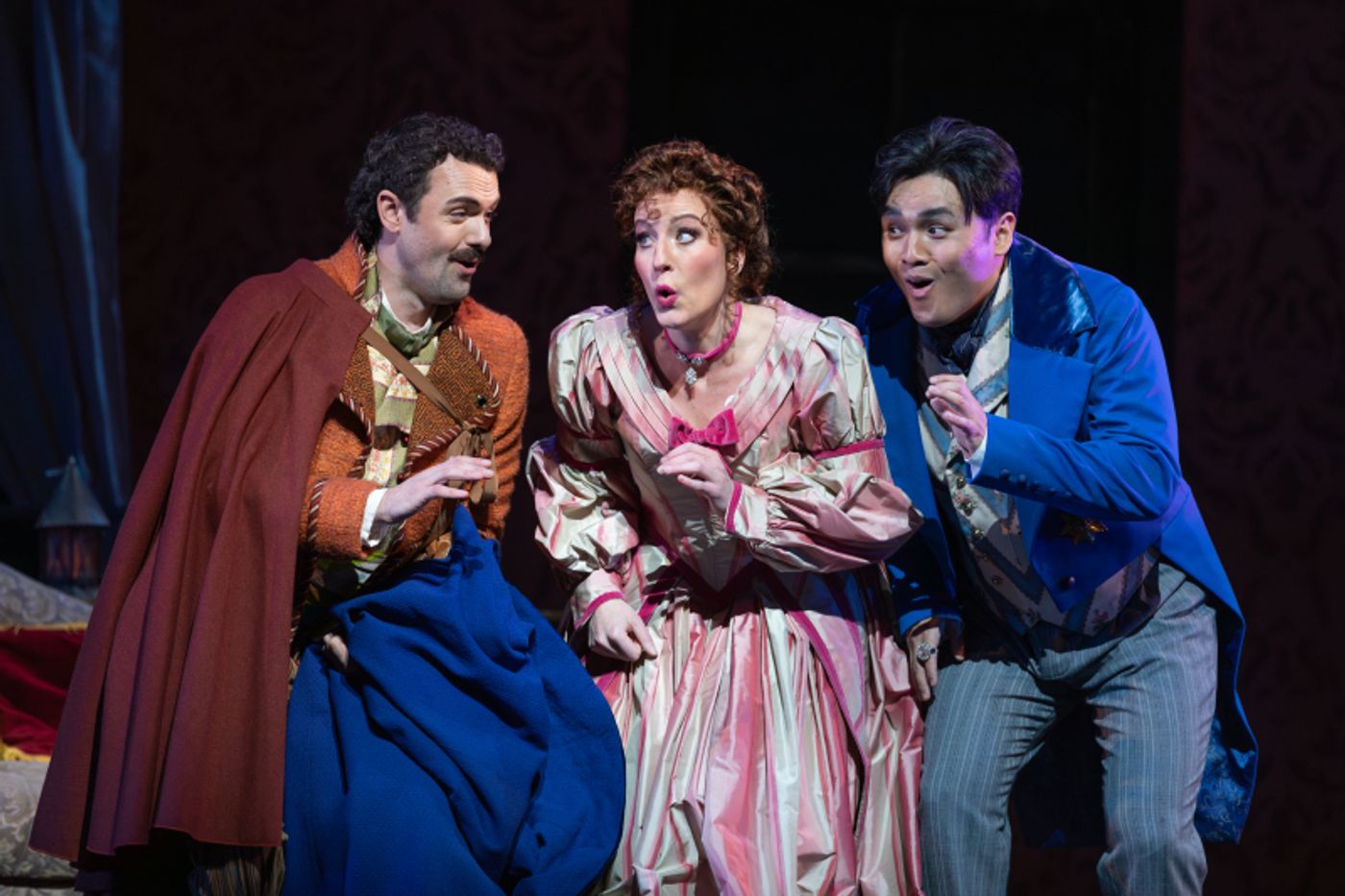 Figaro, Rosina and Almaviva in singing colorful costumes