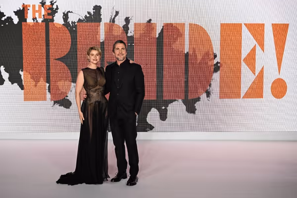 Jessie Buckley and Christian Bale Photo