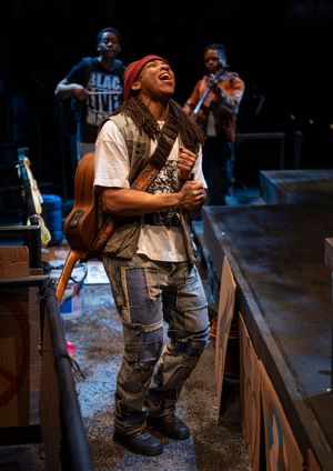 Esco Jouléy with (back, l to r)  Namir Smallwood and Jon Michael Hill  Photo