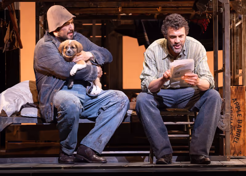 Matthew Pearce (Lennie Small), Waverly (Puppy), and John Moore (George Milton) / Photo © Don Ipock