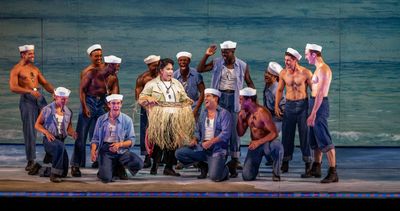 Joan Almedilla (center) and members of the company Photo