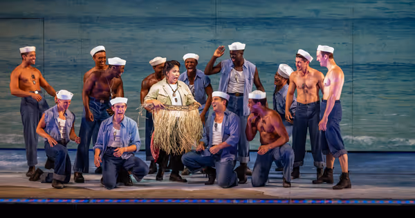 Joan Almedilla (center) and members of the company Photo