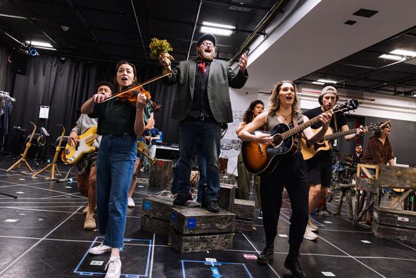 Brandon J. Ellis (center) and the company Photo