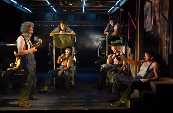 John Keating (second from left), Jon Beavers (far right), and the ensemble Photo