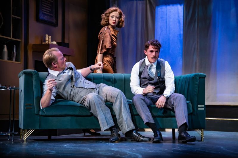 William Henry Blore (Jared Joplin),Vera Claythorne (Di Zhu), and Phillip Lombard (Tim Jones) in "And Then There Were None" - Photo by Ryan Zirngibl