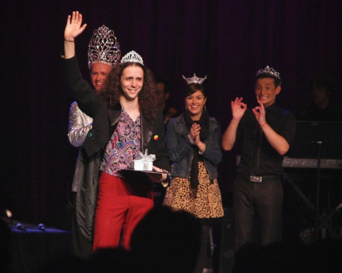 Anthony Hollock surrounded by Marty Thomas, Leigh-Taylor Smith and Frankie James Grande waves to a cheering crowd at 