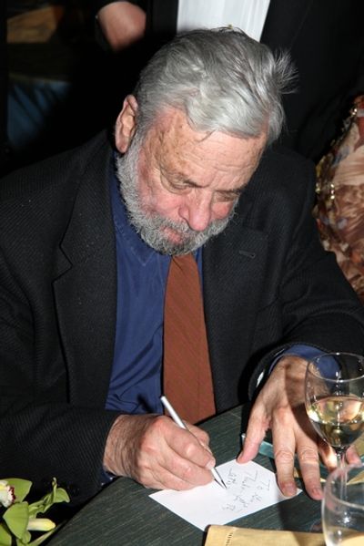 Stephen Sondheim signs a note Photo