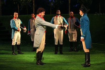 Raul Esparza, Anne Hathaway, and the company Photo