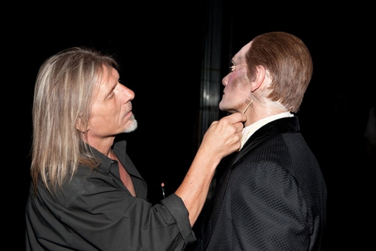 Make-up Artist Ron Wild touches up Anthony Crivello at 