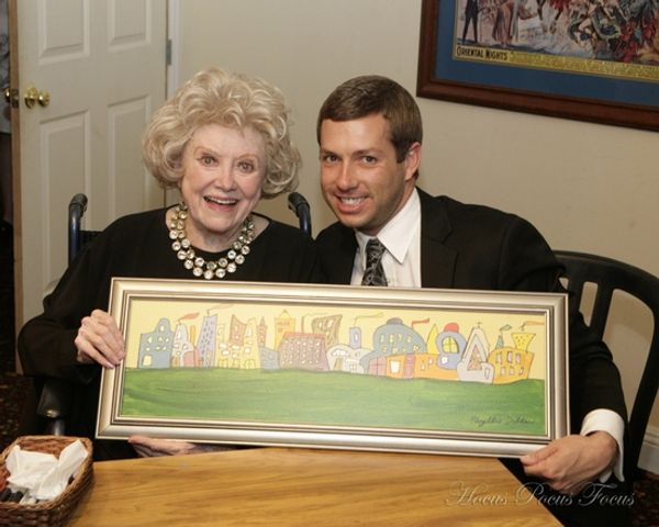 Producer Matt Patton receives a gift of one of Phyllis' artworks Photo