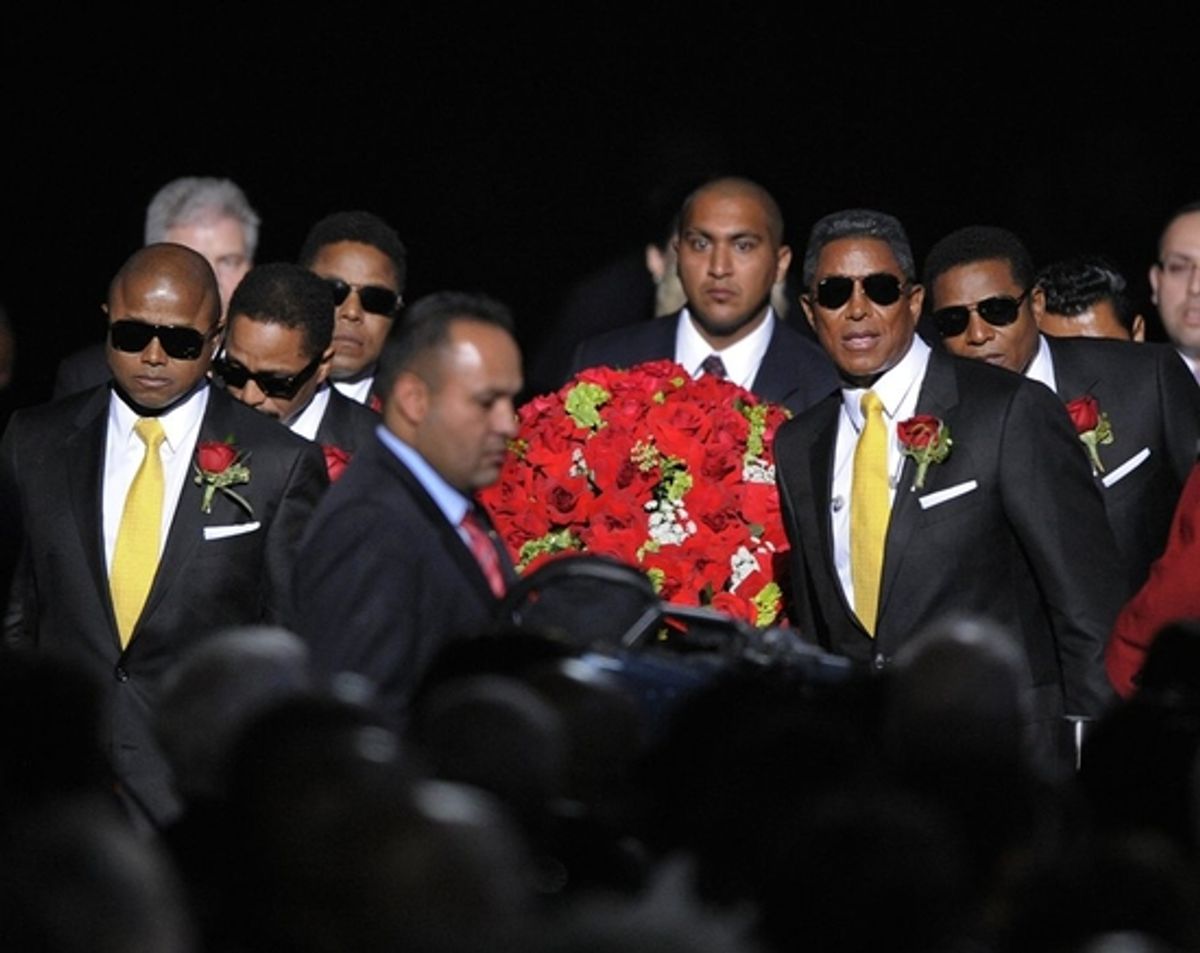 Randy Jackson, Tito Jackson, Marlon Jackon, Jermaine Jackson and family and friends carry Michael Jackson into the Staples Center at 