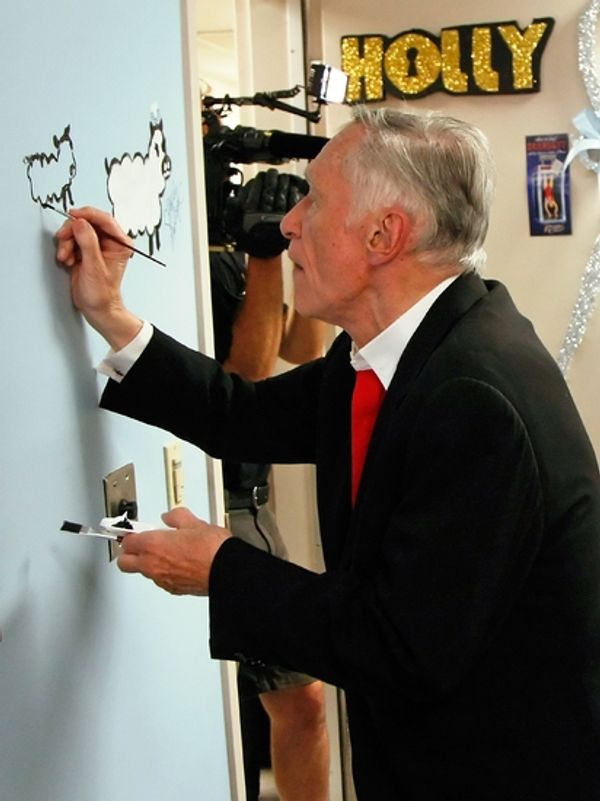 Hugh Hefner painting Sheep Photo