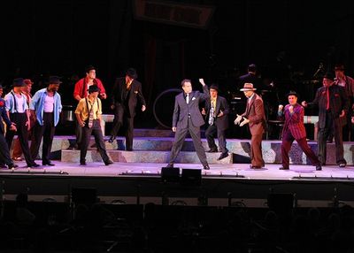 
Brian Stokes Mitchell as "Sky Masterson" leads the men in "Luck Be a Lady" Photo
